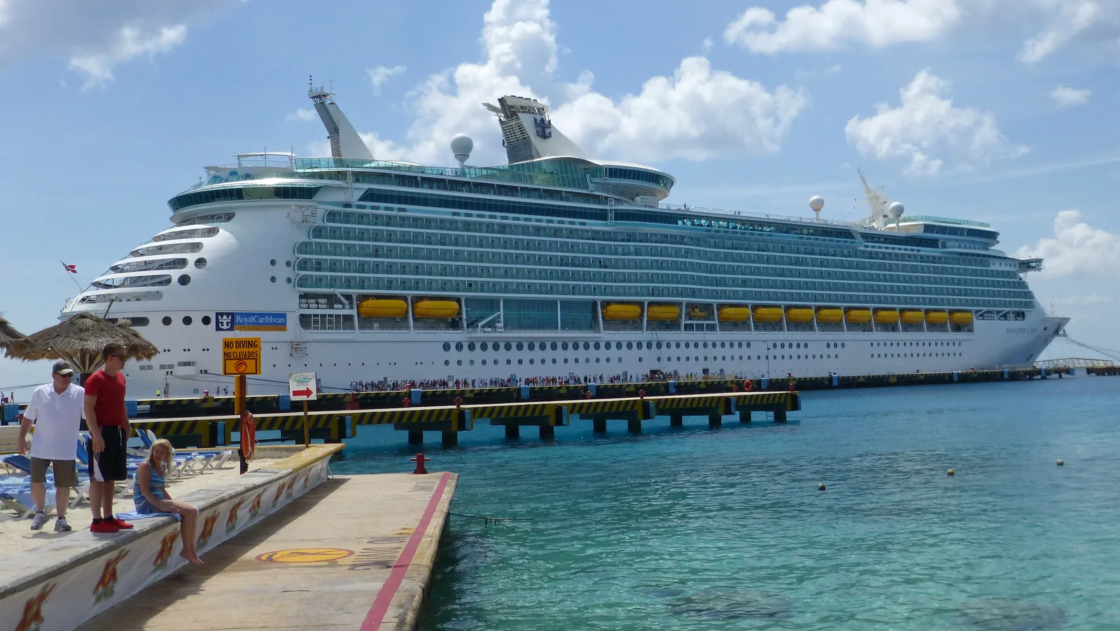 Royal Caribbean’s Navigator of the Seas docked beside turquoise water in Cozumel, Mexico