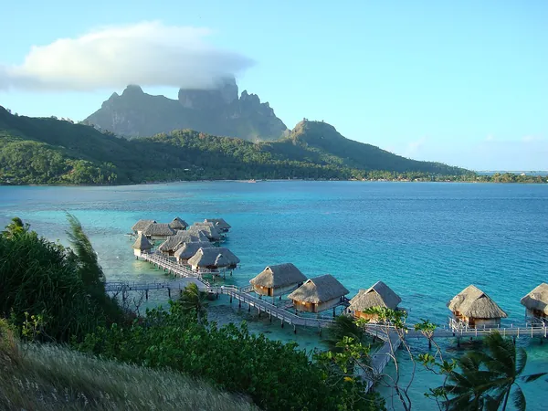 Overwater bungalows on a motu in Bora Bora