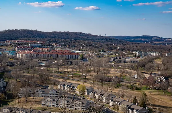 Wooded Ozark hills and Branson buildings near Table Rock Lake