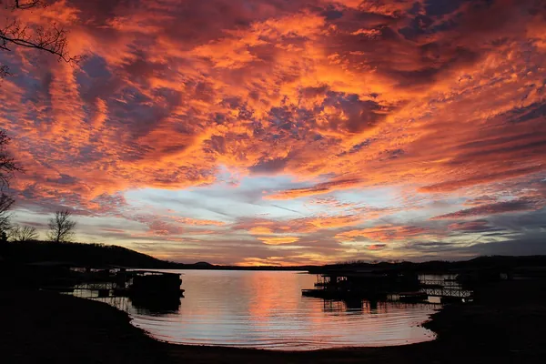 A fiery orange and red sunset over Table Rock Lake in the Ozarks