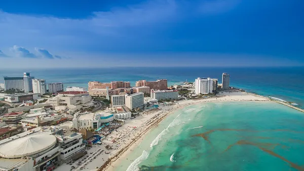 Aerial view of the Cancun Hotel Zone between sea and lagoon