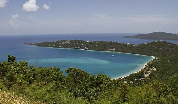 The curving white-sand beach of Magens Bay seen from above, St. Thomas, U.S. Virgin Islands
