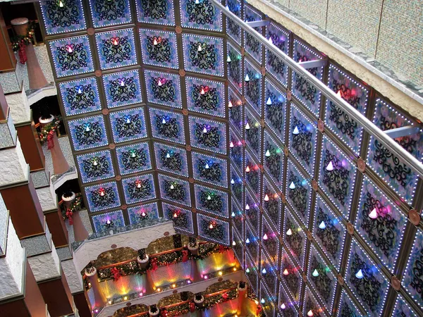 Looking up through the glass-tiled atrium of Carnival Liberty
