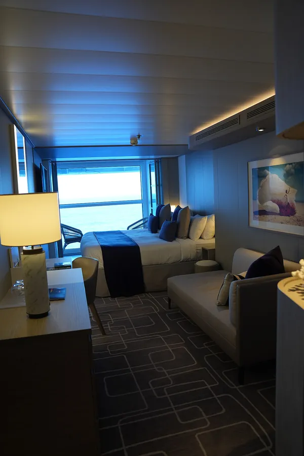 An Infinite Veranda stateroom on Celebrity Apex, with the window wall that turns the room into a balcony