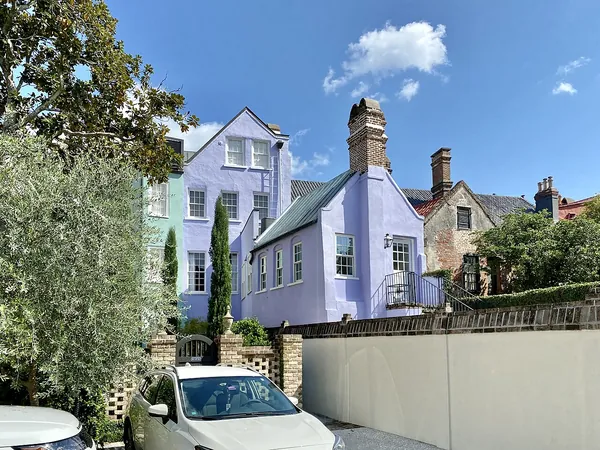 Pastel houses on a sunny street in Charleston’s South of Broad neighborhood