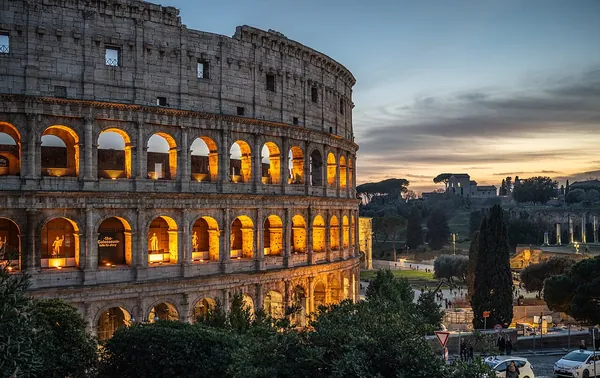 The Colosseum in Rome under a clear sky
