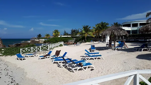 Beach loungers on the shore at Montego Bay, Jamaica