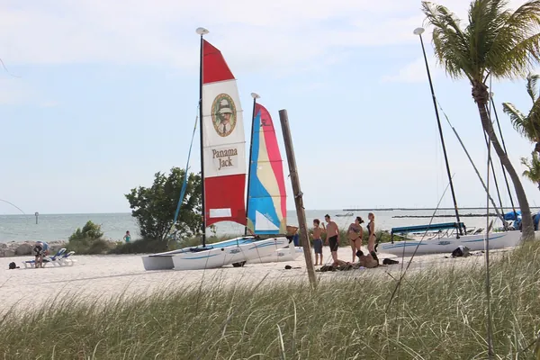 Colorful catamaran sails on the beach in Key West