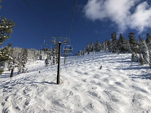 A chairlift above snowy slopes at Heavenly Mountain Resort