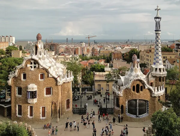 Colorful mosaic gingerbread houses at the entrance to Park Güell in Barcelona, Spain