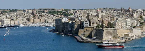 Valletta’s Grand Harbour and fortifications under a blue sky, Malta