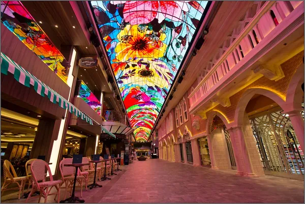 The Galleria Grandiosa promenade under its glowing LED sky ceiling on MSC Grandiosa