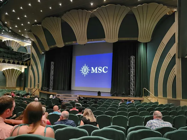 Guests taking their seats in the Royal Theatre on MSC Magnifica