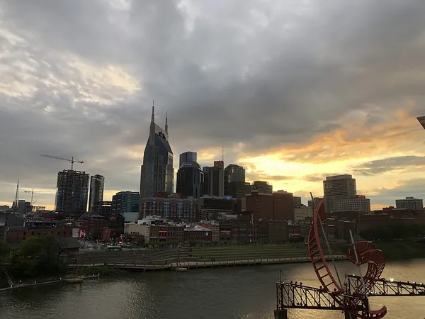Nashville skyline at sunset with a sculpture in the foreground