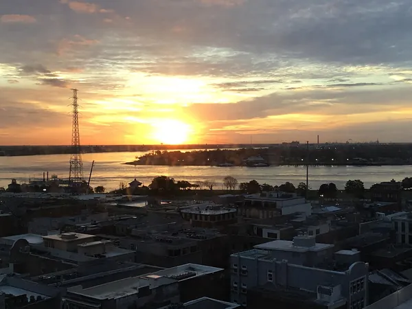 The sun setting over the Mississippi River in New Orleans