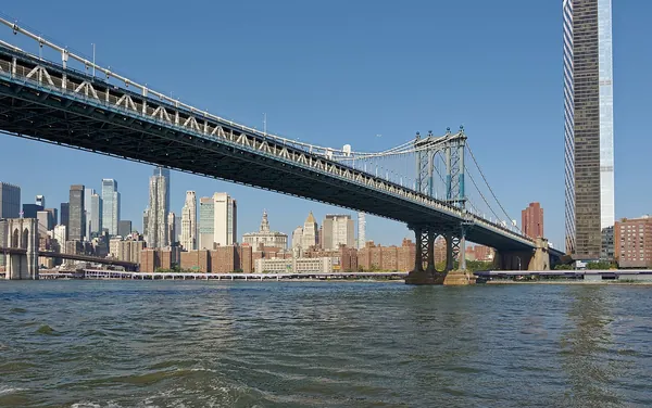 The Manhattan Bridge spanning the East River with the Manhattan skyline behind