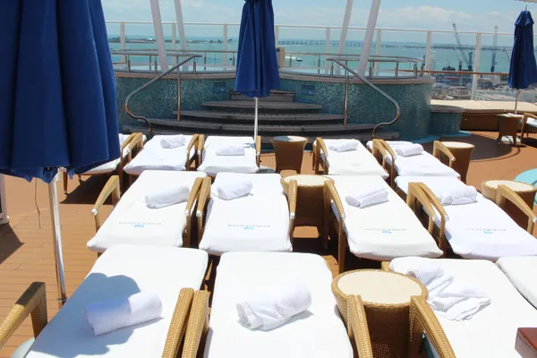 Loungers, hot tubs and cabanas in the adults-only Vibe Beach Club on Norwegian Getaway