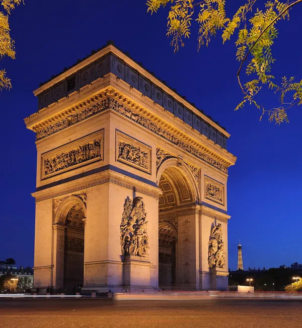 Arc de Triomphe standing at the center of Place de l’Étoile, Paris