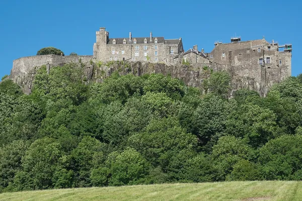 Stirling Castle walls and towers under a blue sky
