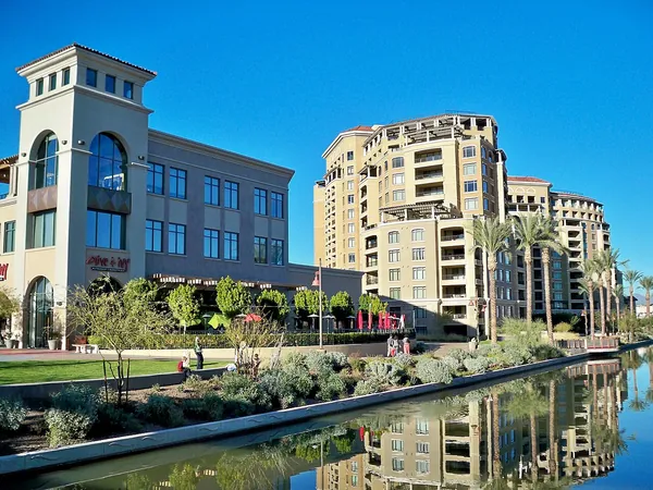 Modern buildings reflected in the canal on the Scottsdale waterfront
