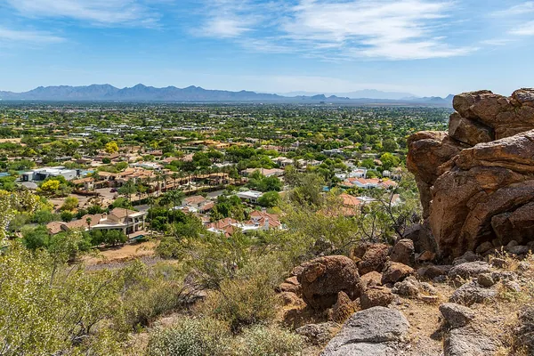 Rocks and desert plants with wide views of the valley from Camelback Mountain