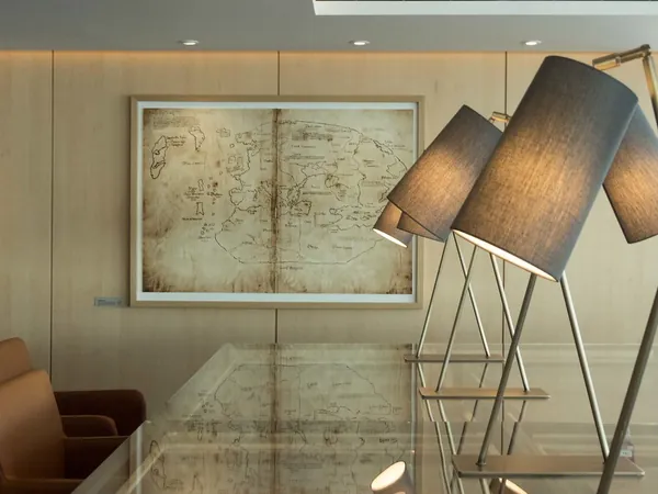 Maps, lamps and big windows in the Explorers’ Lounge on Viking Sun