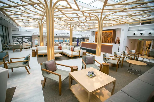 The Wintergarden on Viking Sun, with timber columns branching into a glass ceiling