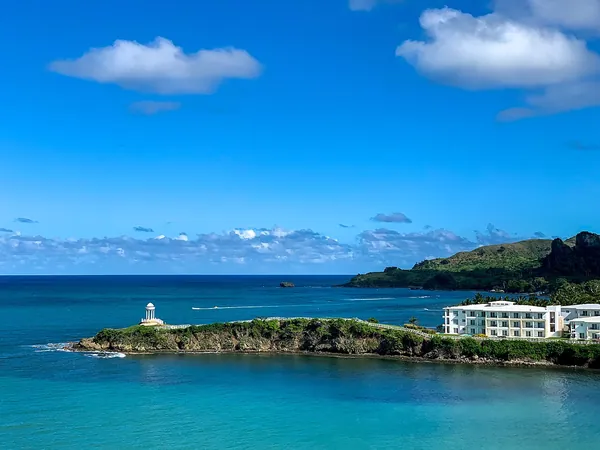 Green hills above the blue bay at Amber Cove, Dominican Republic