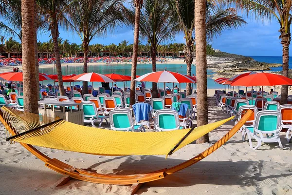 Hammock and loungers under palms at Hideaway Beach, Perfect Day at CocoCay