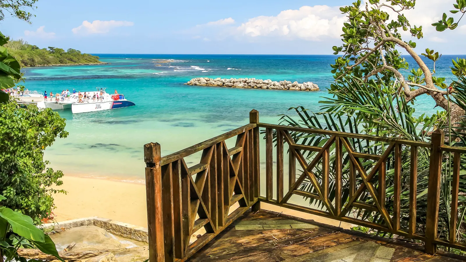Wooden lookout above a turquoise bay near Dunn’s River Falls, Ocho Rios, Jamaica