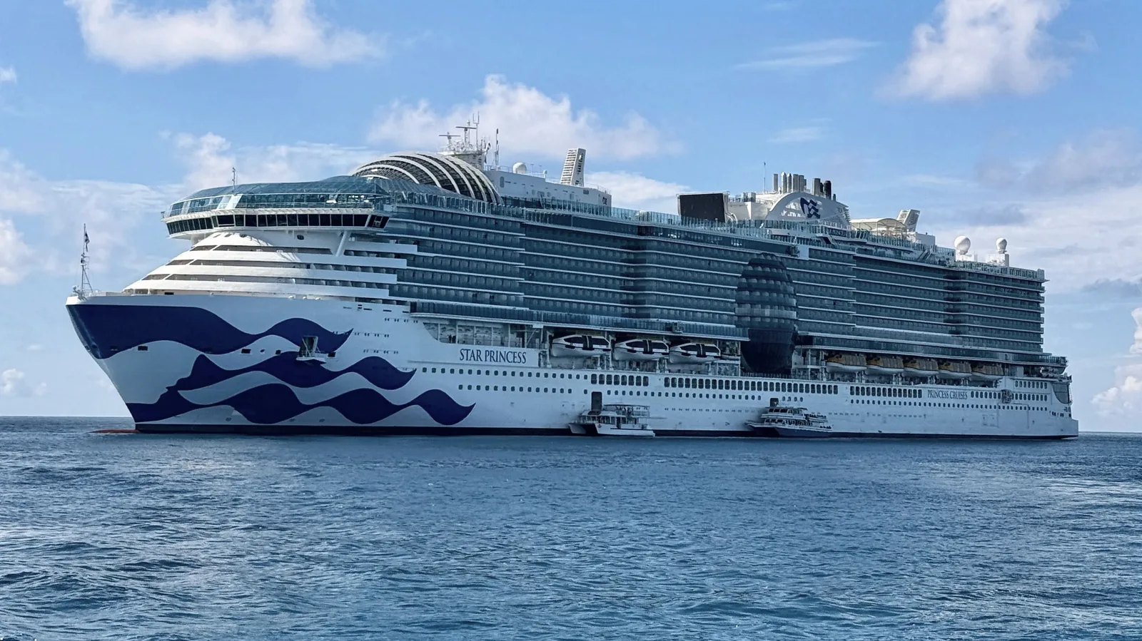 Star Princess, Princess Cruises’ newest ship, with its blue sea-wave bow art on bright blue water