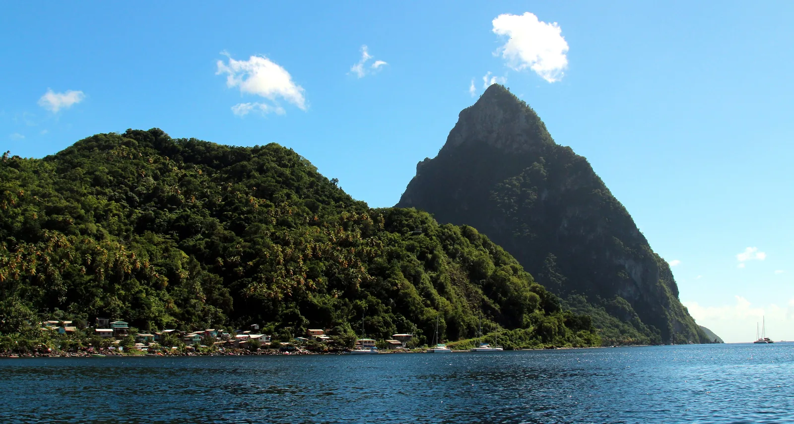 Petit Piton rising above the sea at Soufrière under a blue sky, Saint Lucia