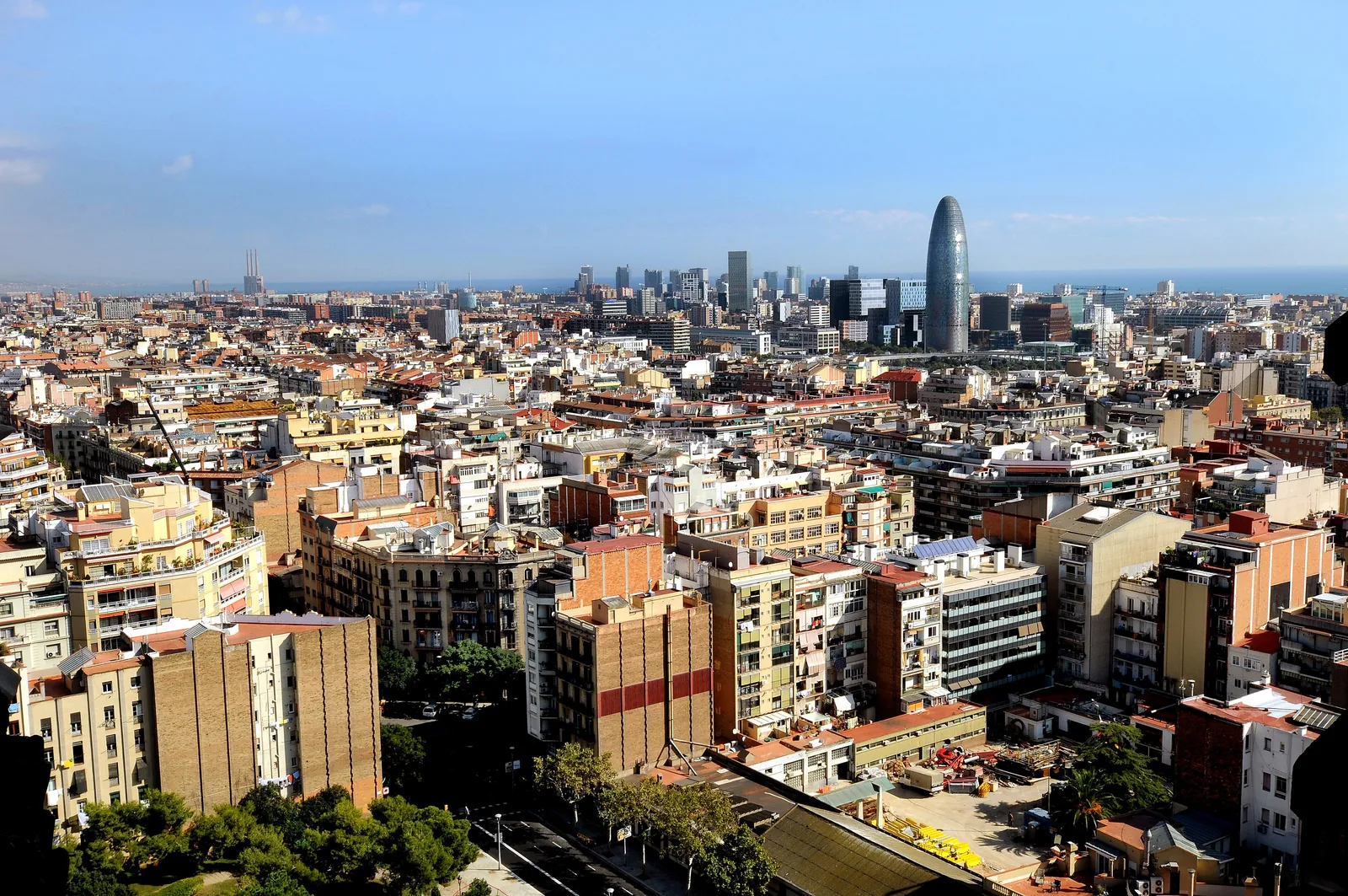 Barcelona skyline with the Mediterranean coast under a clear blue sky